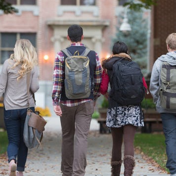 Group of college students walking on campus